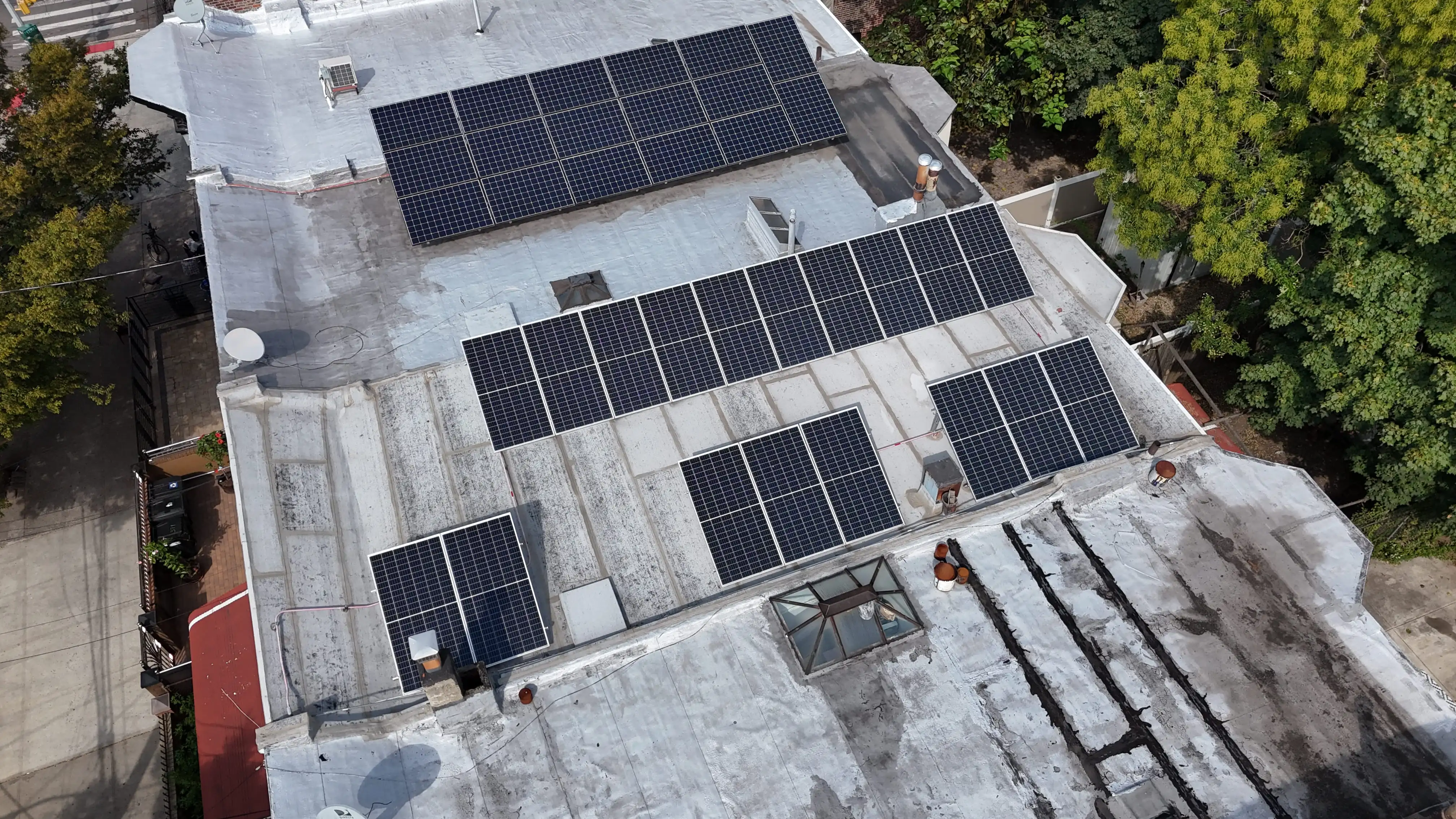 “Aerial view of solar panels on a residential rooftop, photovoltaic system on a flat roof
