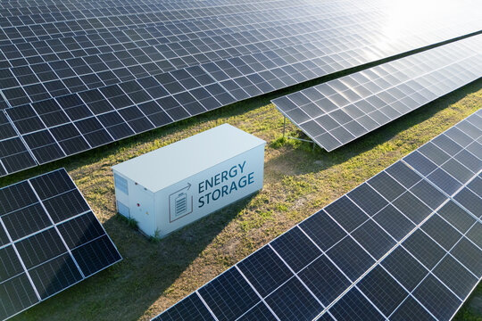 Commercial solar panels with an energy storage battery system installed on site.
